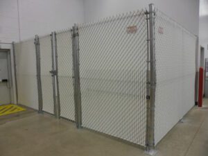 photo of an indoor chainlink fence with white privacy slats
