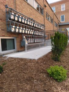 small fence protecting electrical meters