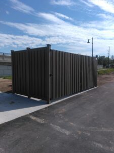a newly built brown privacy fence