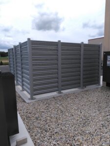 the back of a gray privacy fence