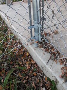 closeup of a chainlink ground plate anchor