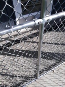 closeup photo of a security fence in front of a door