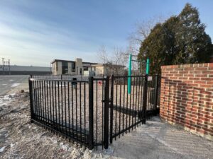 a black ornamental fence around a playground