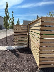 decorative wood fence with a swinging gate