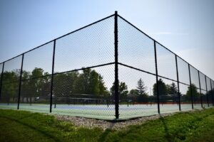 a tall black chainlink fence