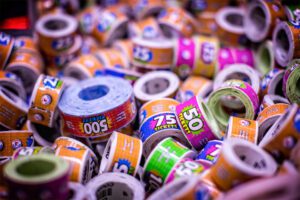 close up shot of rolls of arcade tickets